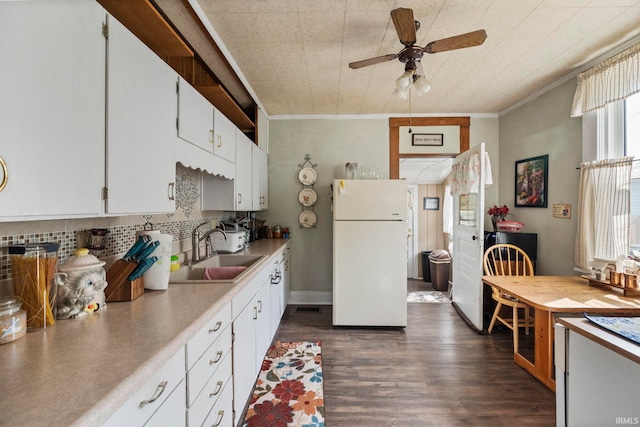 1919 Pierce St, Lafayette, IN 47904 - kitchen featuring freestanding refrigerator, a sink, ceiling fan, ornamental molding, and backsplash