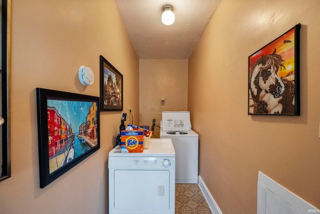 1919 Pierce St, Lafayette, IN 47904 - clothes washing area featuring washing machine and clothes dryer, baseboards, and light flooring