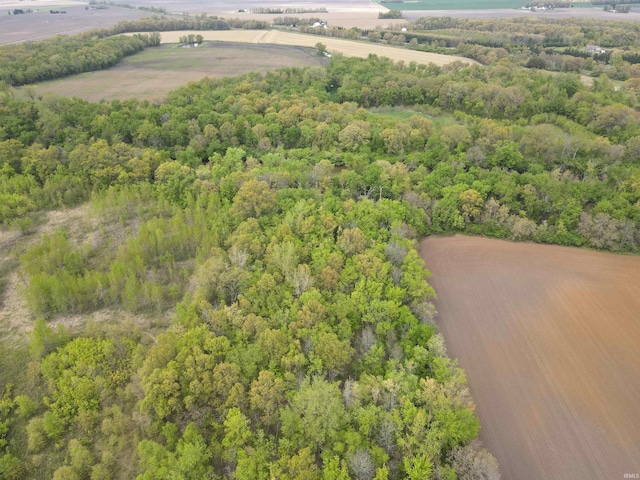 view of rural area featuring a forest