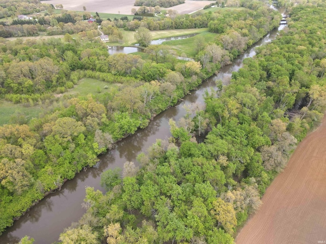 aerial view of property's location with a nearby body of water