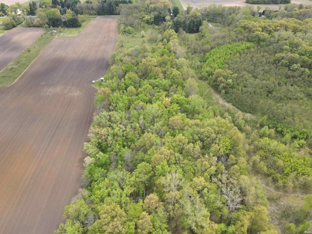 aerial view of property and surrounding area featuring rural landscape