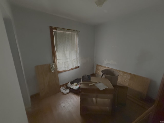 unfurnished room with wood finished floors