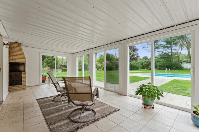 sunroom / solarium with tile patterned floors and plenty of natural light