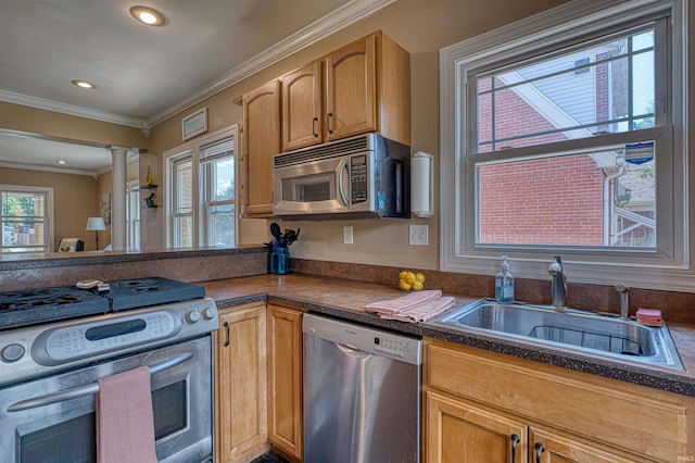 1908 E Mulberry St, Evansville, IN 47714 - kitchen featuring appliances with stainless steel finishes, a sink, ornamental molding, decorative columns, and dark countertops