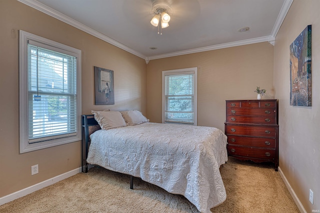 1908 E Mulberry St, Evansville, IN 47714 - bedroom with light carpet, multiple windows, crown molding, baseboards, and ceiling fan