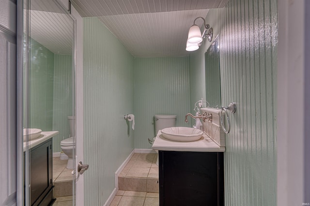 1908 E Mulberry St, Evansville, IN 47714 - bathroom with toilet, vanity, and tile patterned floors