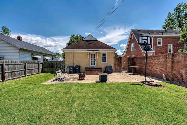 1908 E Mulberry St, Evansville, IN 47714 - back of house with a patio and brick siding