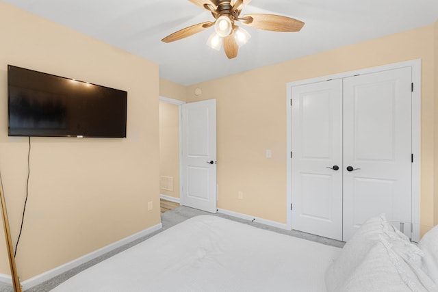 bedroom with baseboards, a closet, and ceiling fan