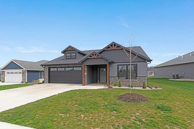 view of front of home featuring stone siding, central AC unit, driveway, a front lawn, and board and batten siding