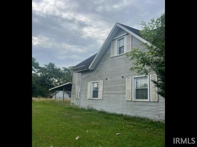 1123 S Jefferson St, Hartford City, IN 47348 - view of side of property featuring a yard