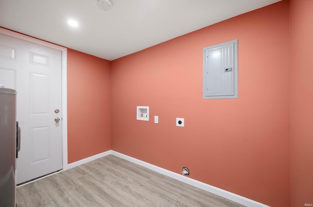 615 W Kickapoo St, Hartford City, IN 47348 - washroom featuring electric panel, hookup for a washing machine, light wood-style floors, hookup for an electric dryer, and baseboards