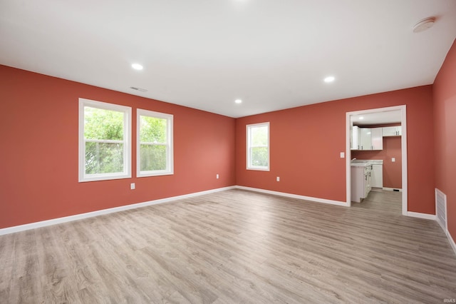 615 W Kickapoo St, Hartford City, IN 47348 - unfurnished room featuring light wood-style floors, baseboards, recessed lighting, and a smoke detector