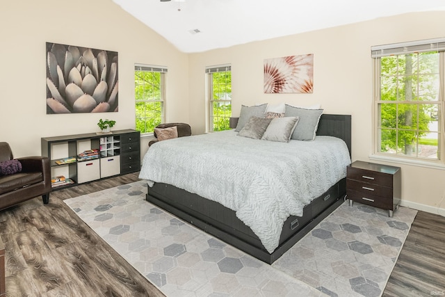 3630 E Tamarron Dr, Bloomington, IN 47408 - bedroom featuring wood finished floors, lofted ceiling, and baseboards