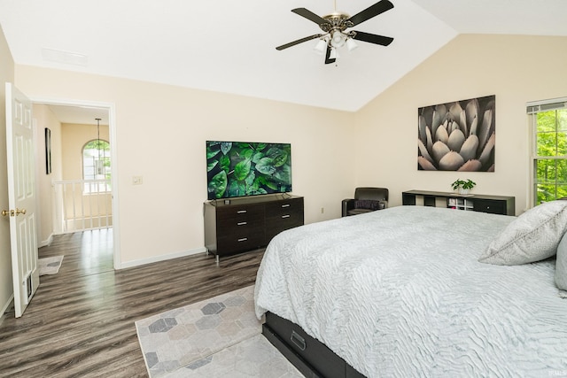 3630 E Tamarron Dr, Bloomington, IN 47408 - bedroom with wood finished floors, lofted ceiling, baseboards, and a ceiling fan