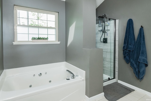 3630 E Tamarron Dr, Bloomington, IN 47408 - bathroom with a shower stall, a jetted tub, tile patterned flooring, and baseboards