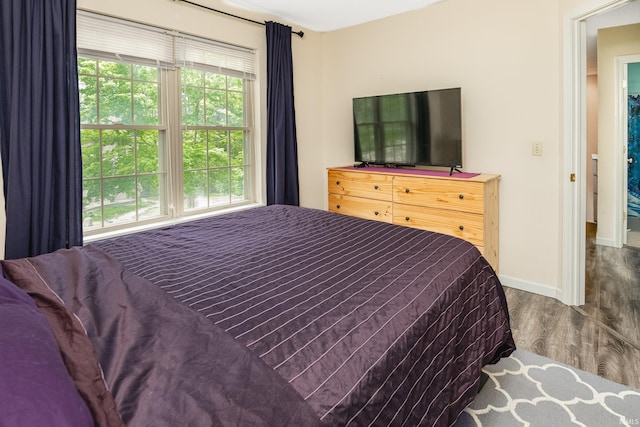 3630 E Tamarron Dr, Bloomington, IN 47408 - bedroom featuring wood finished floors and baseboards