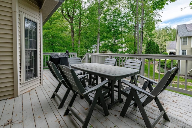 3630 E Tamarron Dr, Bloomington, IN 47408 - deck with outdoor dining area and view of scattered trees