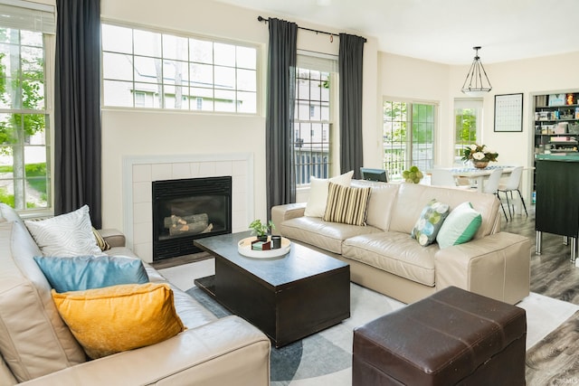 3630 E Tamarron Dr, Bloomington, IN 47408 - living area with wood finished floors and a fireplace