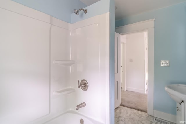 bathroom with  shower combination and baseboards