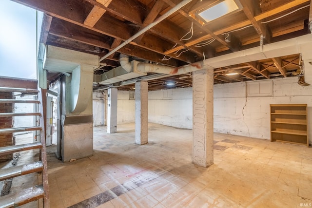 below grade area with heating unit and tile patterned floors