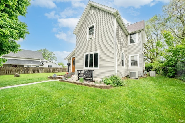 rear view of property featuring central air condition unit