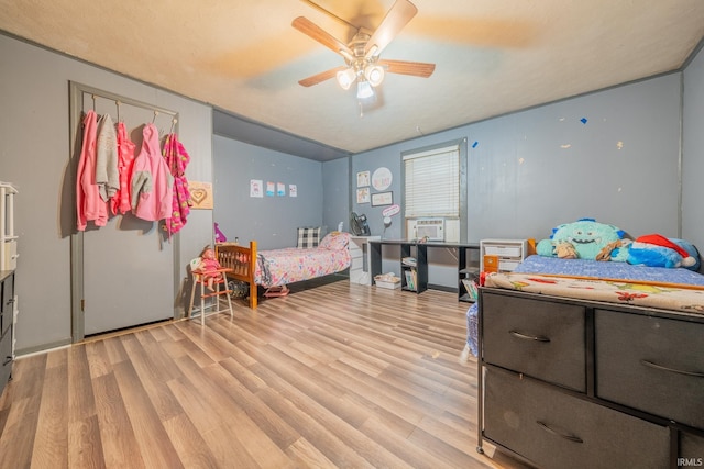 bedroom featuring light wood-style floors and ceiling fan