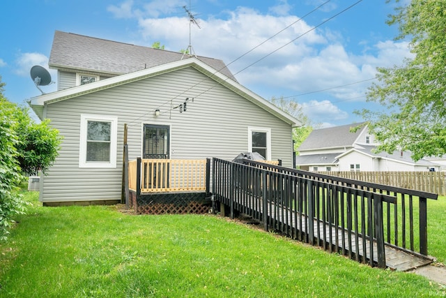 rear view of property with a deck