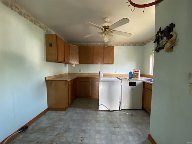 1107 S St, Bedford, IN 47421 - laundry area featuring separate washer and dryer, a ceiling fan, baseboards, cabinet space, and light flooring