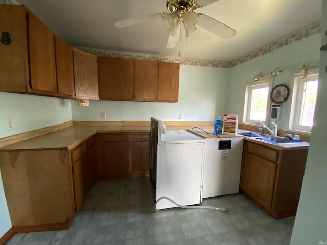 1107 S St, Bedford, IN 47421 - kitchen with brown cabinets, a ceiling fan, light floors, and a sink