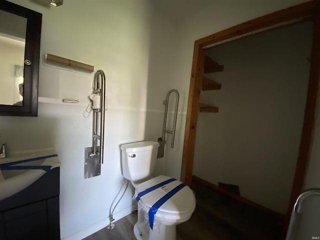 1107 S St, Bedford, IN 47421 - bathroom with toilet, vanity, wood finished floors, and baseboards