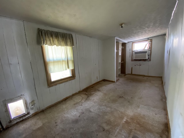 1107 S St, Bedford, IN 47421 - empty room with cooling unit and wooden walls