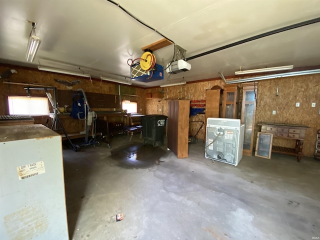 1107 S St, Bedford, IN 47421 - garage featuring a garage door opener and a workshop area