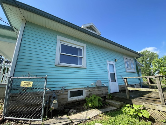 1107 S St, Bedford, IN 47421 - rear view of house with a deck, a gate, and fence