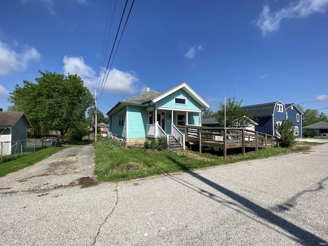 1107 S St, Bedford, IN 47421 - view of front of house with asphalt driveway and covered porch