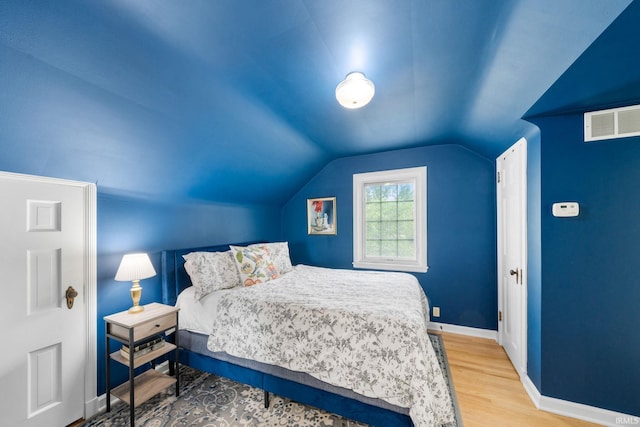 227 N Twyckenham Dr, South Bend, IN 46617 - bedroom with wood finished floors, lofted ceiling, and baseboards