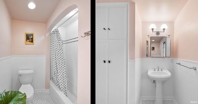 227 N Twyckenham Dr, South Bend, IN 46617 - full bath with a wainscoted wall, toilet, tile patterned floors, and shower / bath combination with curtain