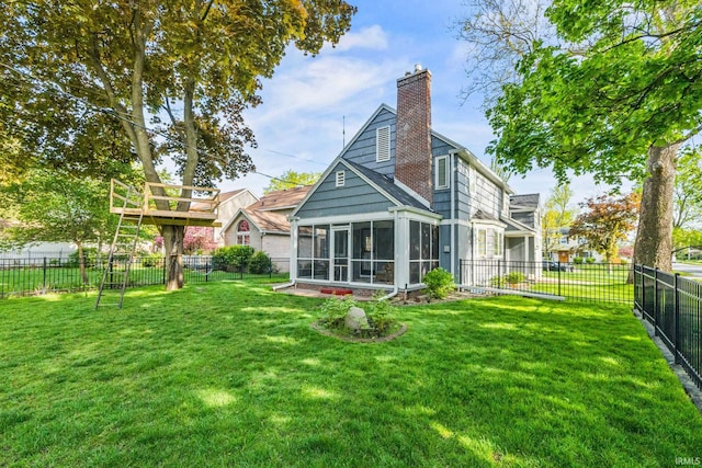 227 N Twyckenham Dr, South Bend, IN 46617 - back of house with a sunroom and a chimney