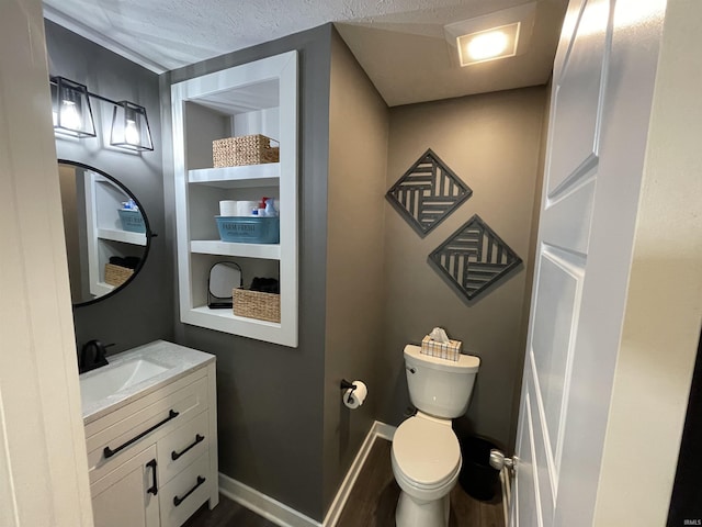 2327 Jamaica Ct, Evansville, IN 47725 - bathroom featuring vanity, toilet, and wood finished floors