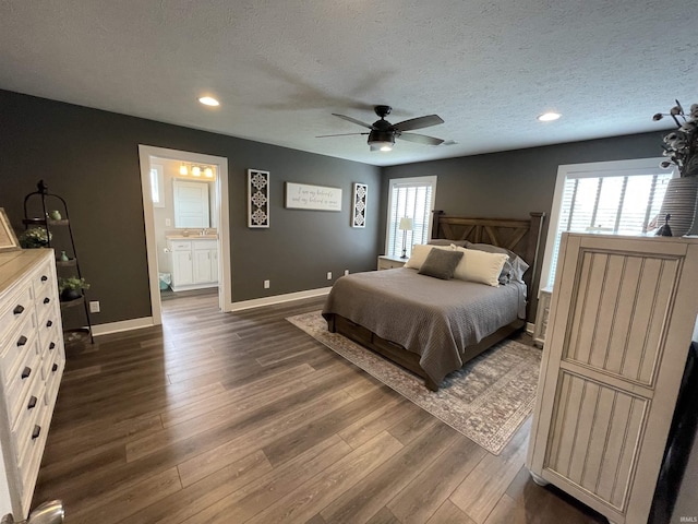 2327 Jamaica Ct, Evansville, IN 47725 - bedroom featuring dark wood-type flooring, baseboards, recessed lighting, a textured ceiling, and ceiling fan