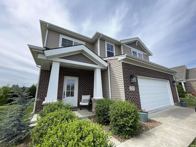 2327 Jamaica Ct, Evansville, IN 47725 - view of front of home featuring driveway, brick siding, and a garage