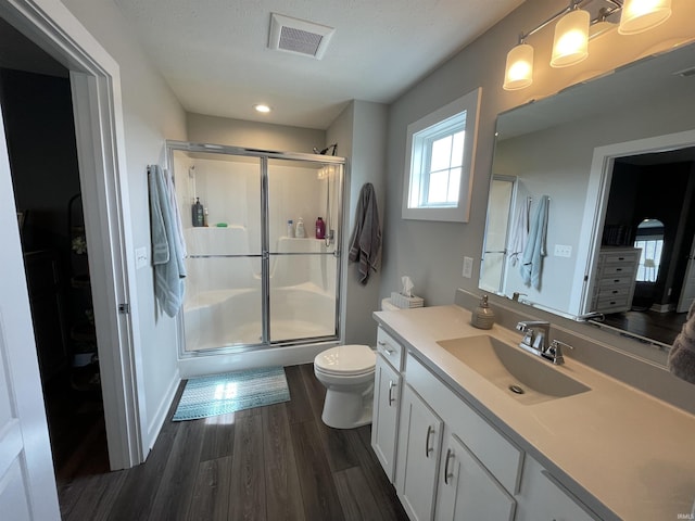 2327 Jamaica Ct, Evansville, IN 47725 - bathroom with toilet, wood finished floors, a shower stall, vanity, and recessed lighting