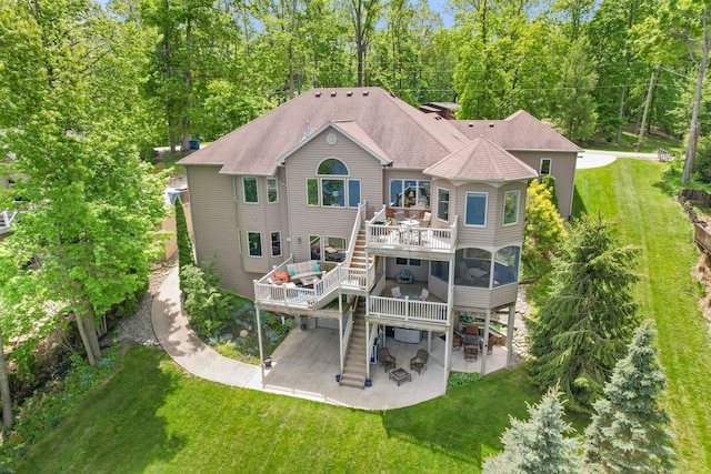 1715 E Schug Rd, Columbia City, IN 46725 - rear view of house with a patio, stairs, a deck, a lawn, and a sunroom