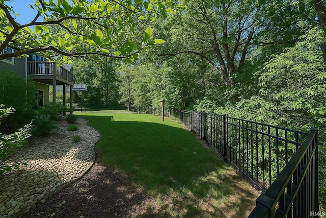 view of yard featuring a balcony
