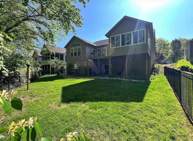 rear view of property with stairs and a deck