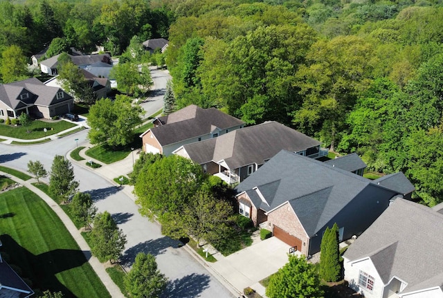 aerial perspective of suburban area featuring a forest