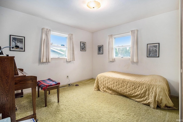 carpeted bedroom with baseboards
