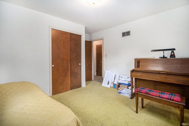 carpeted bedroom featuring a closet