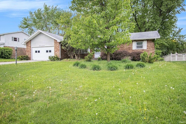 view of front of property featuring brick siding, driveway, and a garage