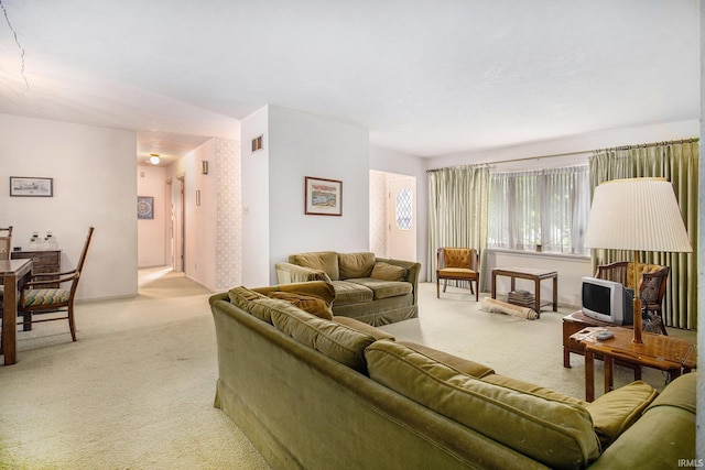 living area with light colored carpet