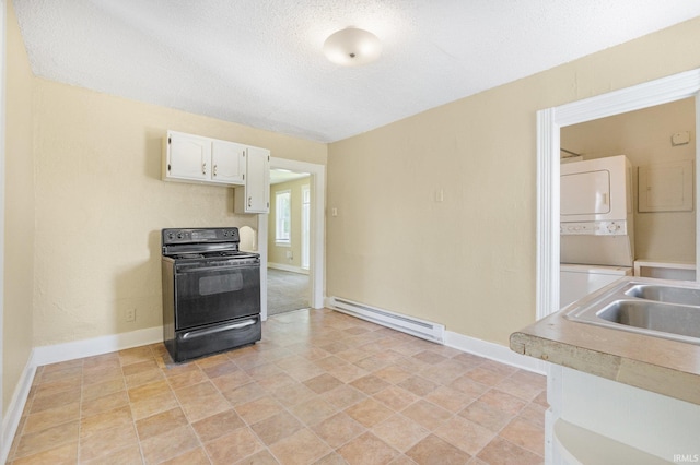 kitchen featuring electric range, baseboard heating, estacked washer and dryer, baseboards, and a textured ceiling